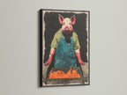 The Pig Chef canvas print is presented in a sleek black frame. This frame provides a contemporary contrast. The artwork features a pig chef tending a BBQ. The black frame enhances the bold colors and details. It is great for adding character to a dining room.