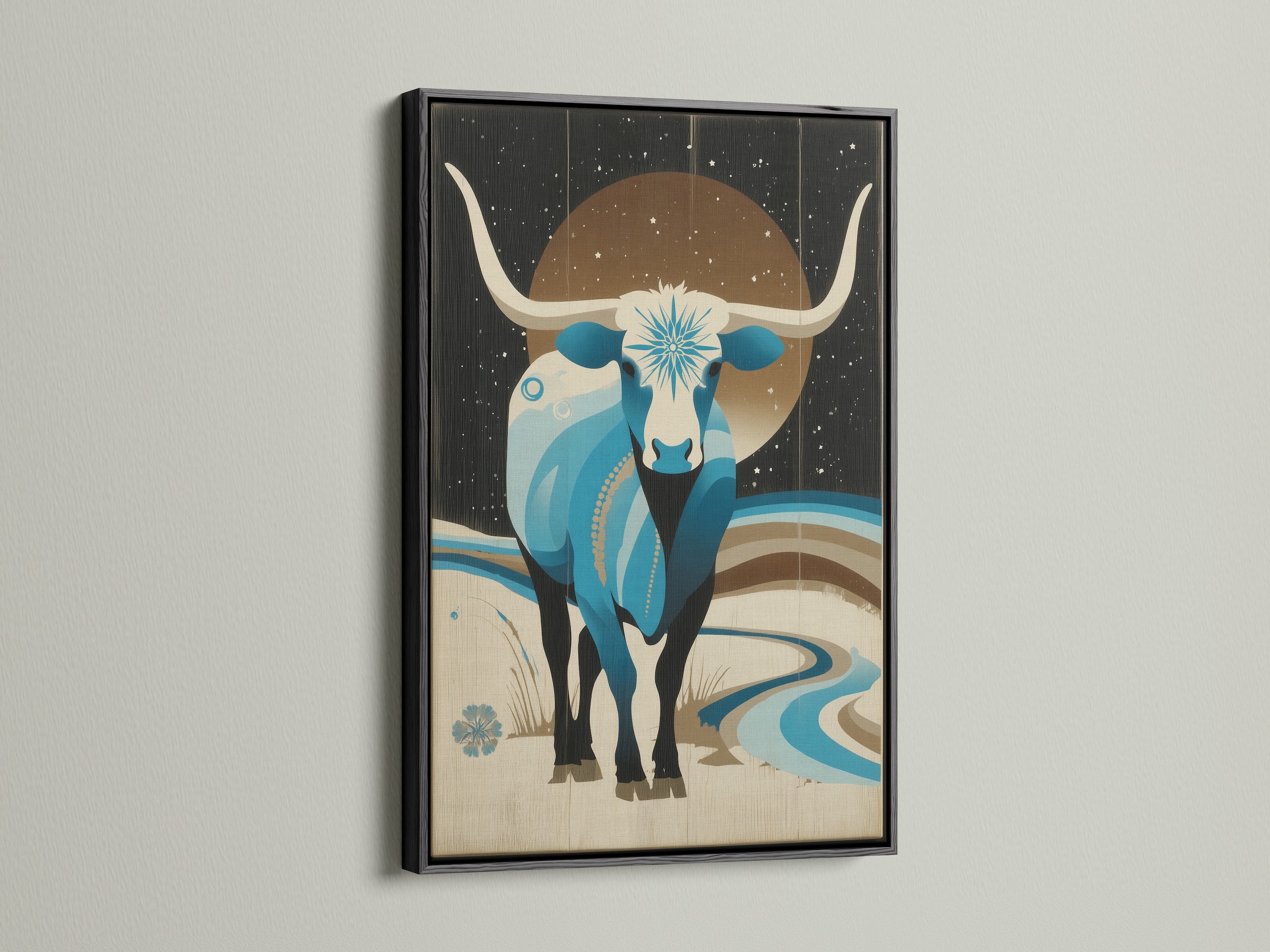 A black frame surrounds the Celestial Bull artwork. This bull canvas art is a captivating piece. It's suitable for Southwestern decor. The teal wall art brings color to your space. This is perfect office wall art and will wow anyone.