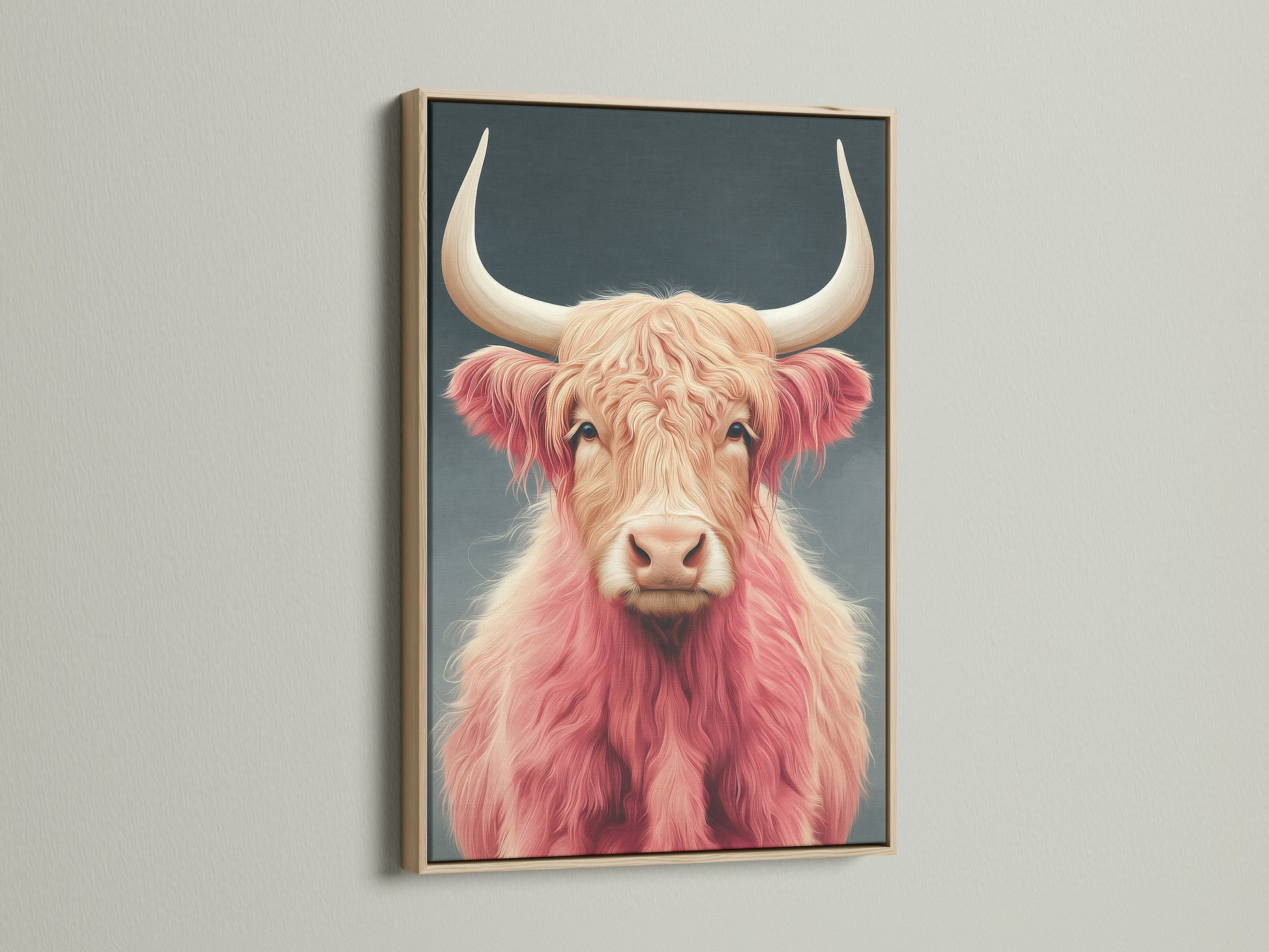 Pink Highland Cow art in an oak frame. The fluffy cattle art adds charm to any space. Perfect animal canvas art for farmhouse or Scandinavian decor. This Scottish cow decor is unique.