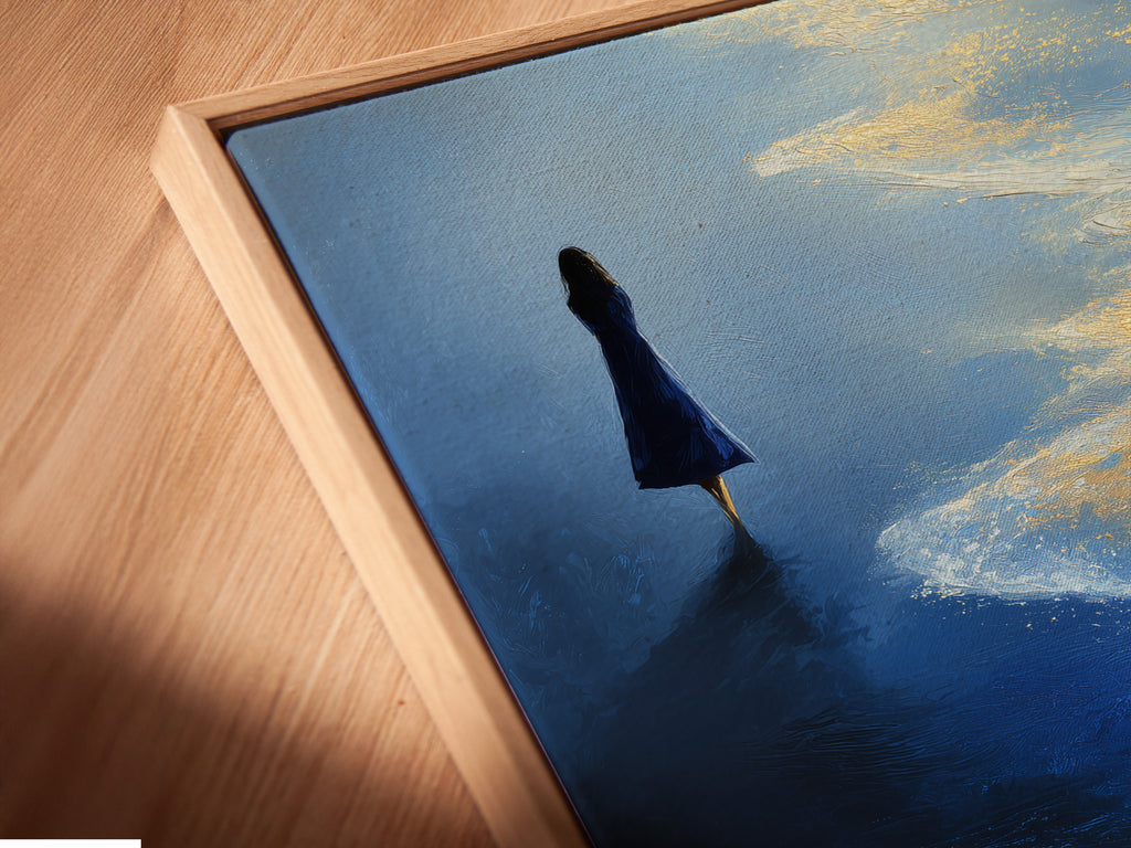 A close-up angled view of a canvas print in a floating frame. The artwork is Ocean Solitude. This modern wall art enhances any space. The floating frame adds a touch of elegance to the blue and gold seascape.