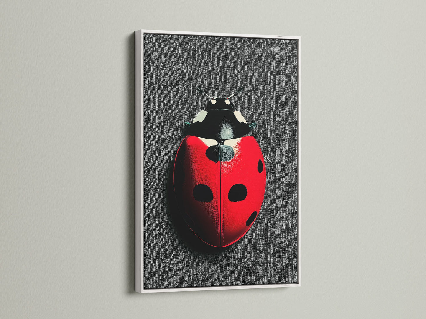 A white frame highlights the ladybug art print. The contrast makes the red and black colors pop. This beetle print is suitable for kids rooms playrooms or as dorm decor. The white frame offers a clean modern look.