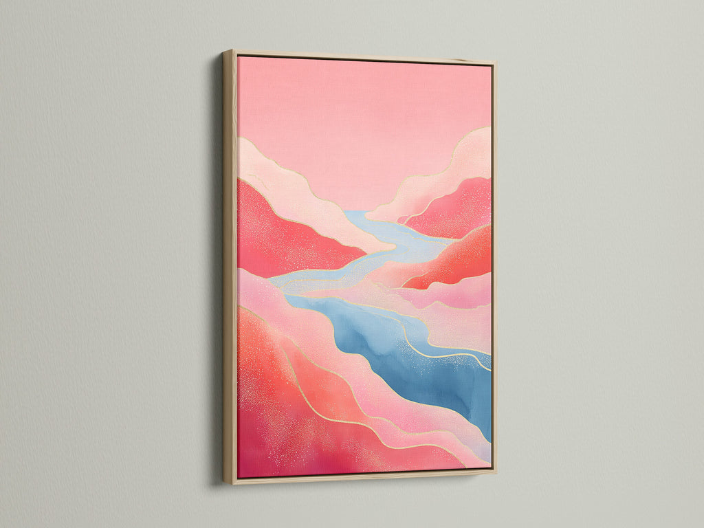 An abstract river canvas art print displayed in an oak frame. The pink mountain art and flowing river create a serene modern nature print. Perfect for adding a bohemian style to your living room.