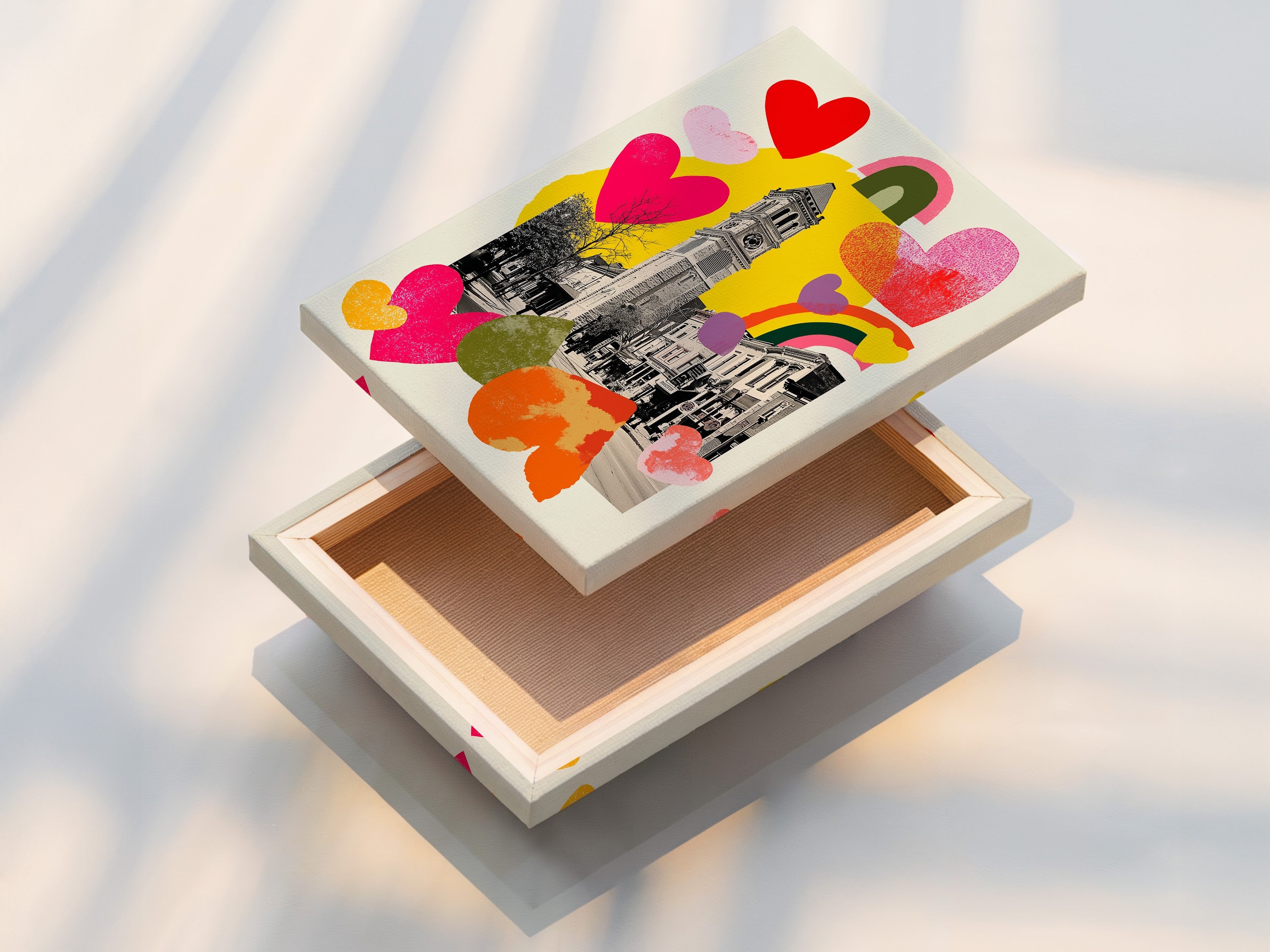 A stretched canvas print ready to hang. The art features a clock tower.  It also has colorful hearts and rainbows. The stretched canvas offers a gallery-wrapped look.  It enhances the visual impact of the artwork.  Transform your space with our high-quality canvas prints today.