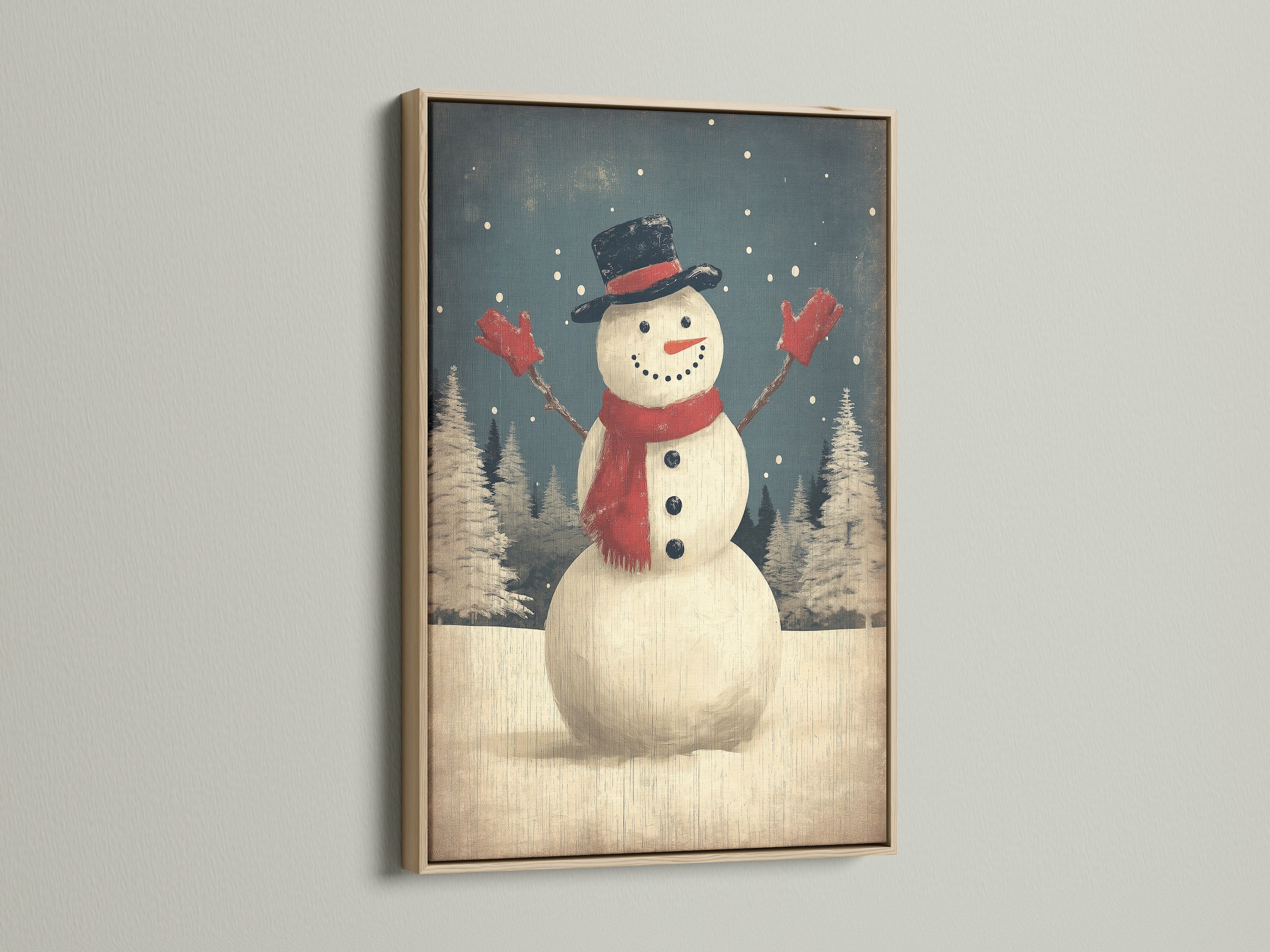 A charming snowman winter art print graces a wall in an oak frame. The artwork brings a touch of rustic holiday cheer to the room. Perfect for christmas wall decor and farmhouse christmas styles.