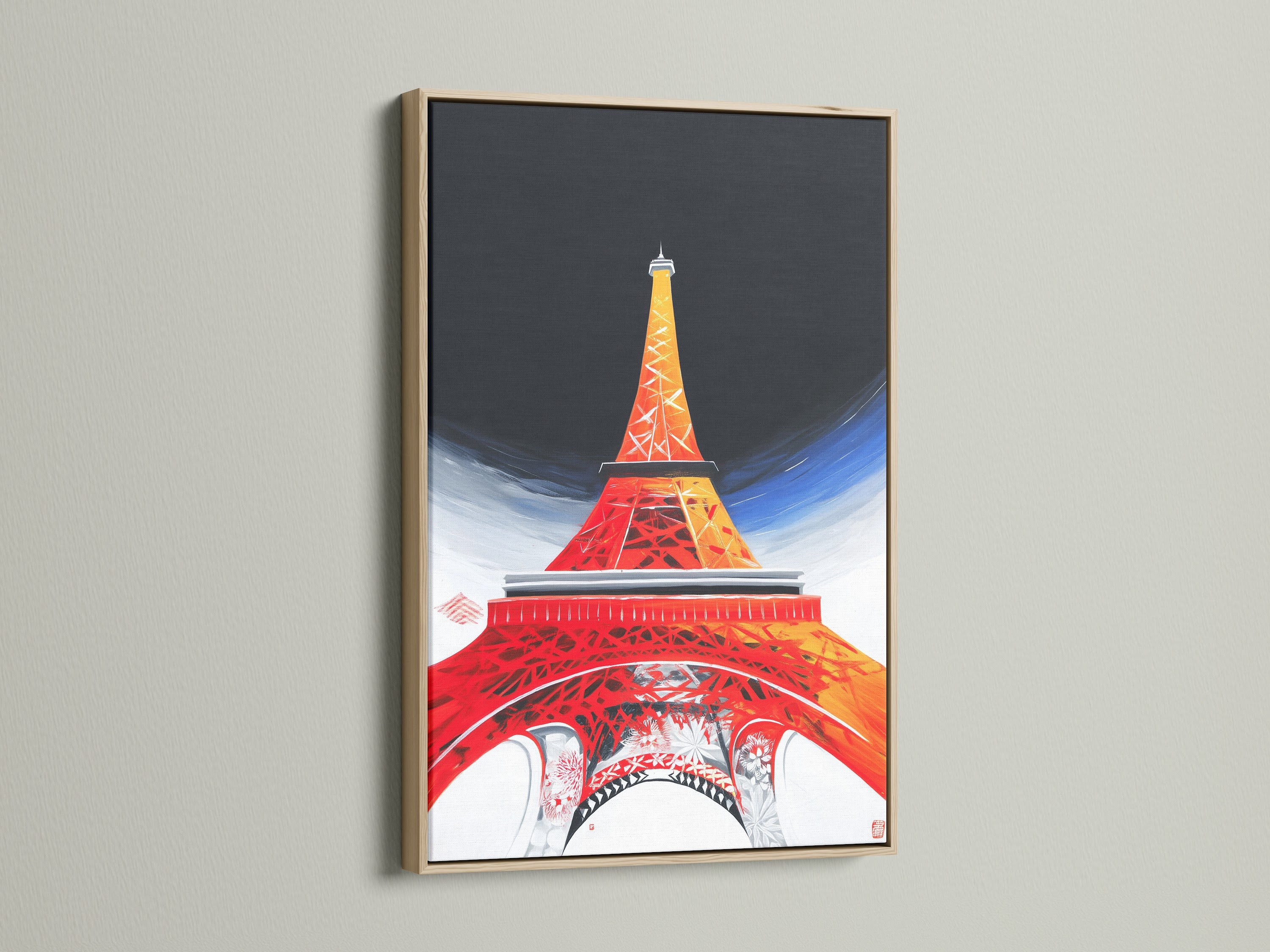 A close-up of an Eiffel Tower canvas print displayed in an oak frame. The natural wood grain enhances the art. Our oak frames add warmth and sophistication to your French decor. Elevate your architecture print with this timeless frame.