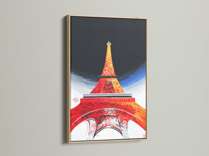 A close-up of an Eiffel Tower canvas print displayed in an oak frame. The natural wood grain enhances the art. Our oak frames add warmth and sophistication to your French decor. Elevate your architecture print with this timeless frame.