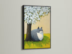 Here is a stylish black frame showcasing a cat under tree artwork. This animal canvas print offers a minimalist spring blossom art piece. The cute cat artwork enhances living rooms and bedrooms. Perfect for those seeking nature animal prints and peaceful cat art.