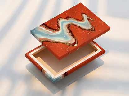 This stretched canvas print showcases abstract river art. The flowing water artwork is ready to hang. Coral orange and teal tones bring modern flair. Perfect for living rooms bedrooms and boutiques. Elevate your space with this contemporary piece.