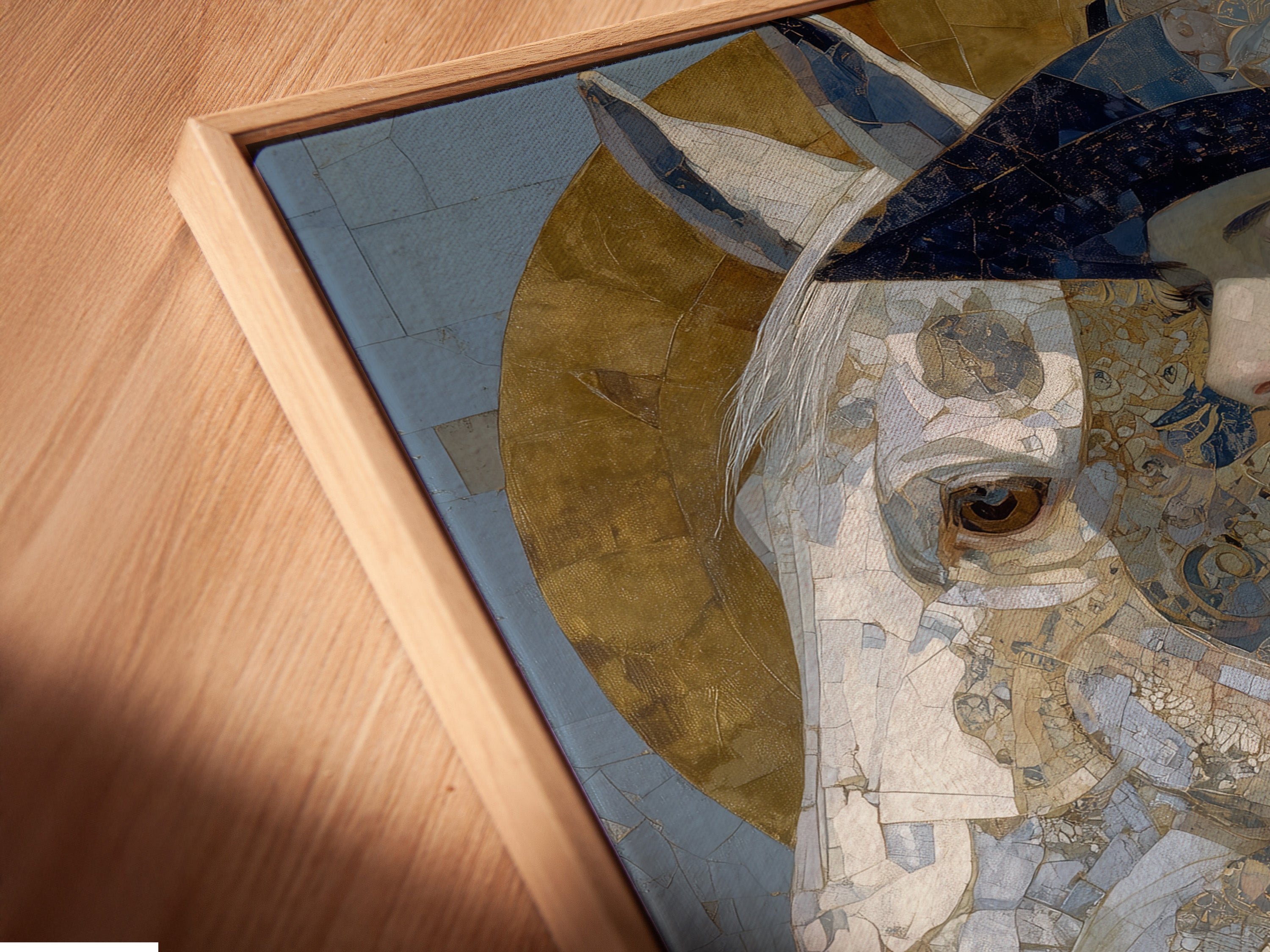 A close-up view reveals the exquisite details of the canvas print in a floating frame. This Art Nouveau Woman artwork features a vintage portrait of a woman and horse in captivating blue and gold tones. Add sophistication to your decor with this unique piece. Perfect for boutique art or salon decor.