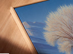 Close-up angled view of a canvas print. The canvas is displayed in a floating frame. Floating frames create a modern gallery look. It gives the illusion that the art is floating. This unique style enhances any space.