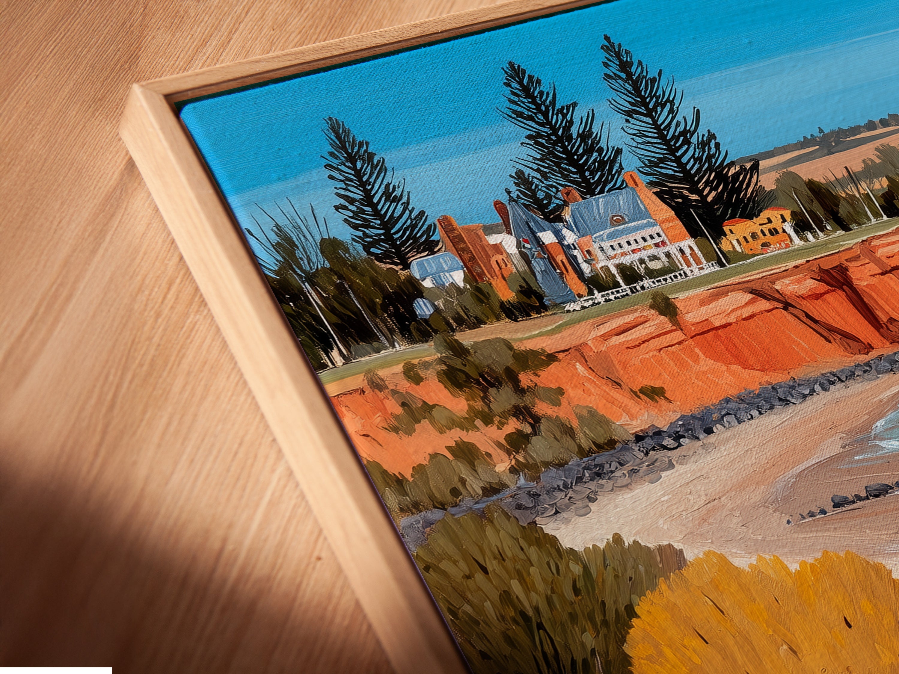 Close-up angled view of a canvas print in a floating frame. The coastal landscape artwork showcases vibrant colors and intricate details. This framing style adds depth and sophistication to the seascape print. Ideal for modern interiors. Bring the beauty of Australian art into your home. Shop now.