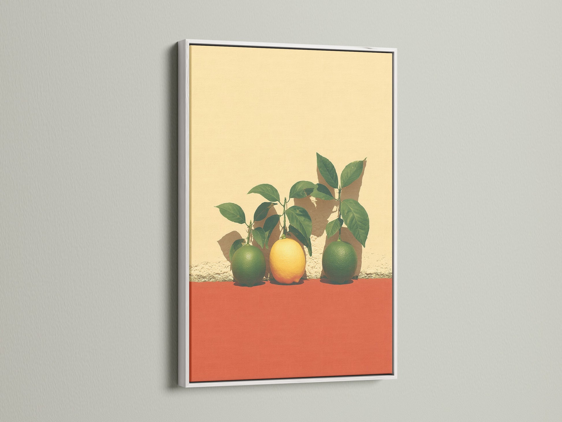 Citrus Fruit Artwork in a white frame. This modern art print features yellow and green fruit. The white frame complements the vibrant wall art. Ideal for kitchen wall art or dining room decor. A colorful artwork choice.