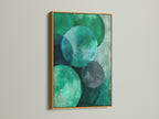 Abstract Geometric Canvas art in a gold frame. The artwork features emerald green circles. This modern textured print is great for office wall decor. Perfect for homeowners renters interior designers and business owners seeking elevated modern art.