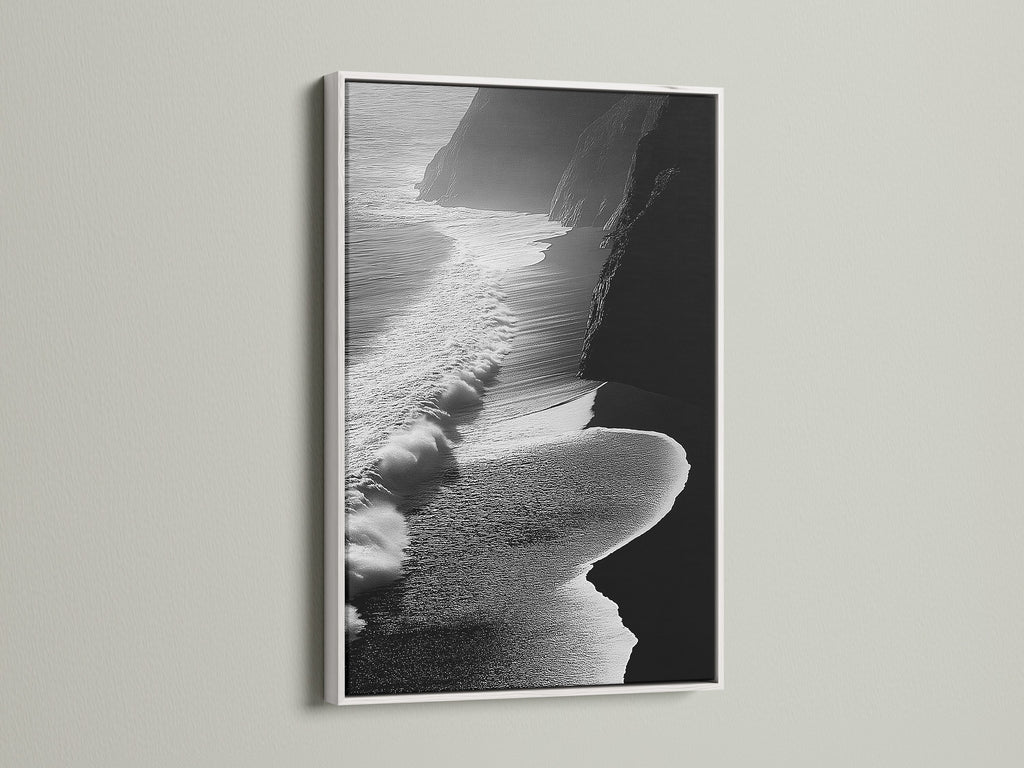This black and white ocean waves artwork stands out. It has a clean white frame. Ideal for contemporary coastal decor in any room. The aerial beach photography brings a serene touch. The white frame enhances the artwork's minimalist style. Perfect for brightening up living rooms or bedrooms. A stunning piece of ocean artwork to elevate your space.
