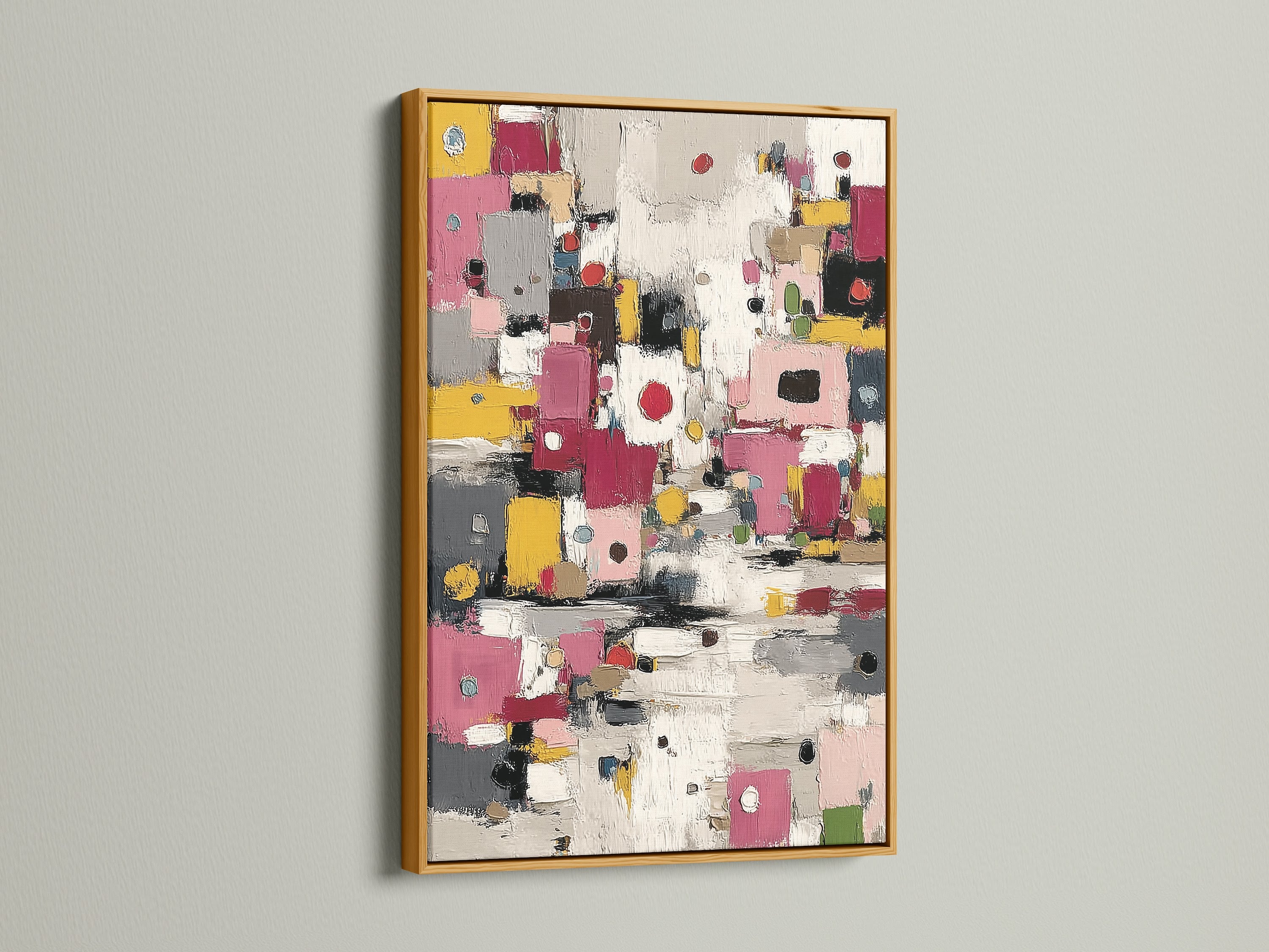 Gold frame art print against a clean white wall. The abstract colorful artwork is a modern geometric design. Pink yellow decor adds a touch of elegance. Perfect for contemporary home or office spaces.