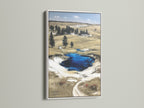 White frame displays Wyoming landscape artwork. Ideal for rustic farmhouse neutral or nature-inspired styles. The Grand Prismatic Springs Yellowstone National Park poster is great for living rooms cabins offices and libraries. Nature wall art brings scenic artwork to any space.