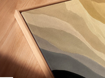 A close-up angled view of a canvas print in a floating frame. The abstract boat art has neutral tones of beige and gray. This minimalist seascape artwork enhances any space. Ideal for office decor. The modern artwork complements minimalist and modern styles.