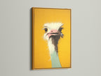 A colorful ostrich art print is luxuriously displayed in a gold frame. The gold frame adds a touch of opulence and glamour. This is a statement piece for any art lover. Shop our framed art collection.