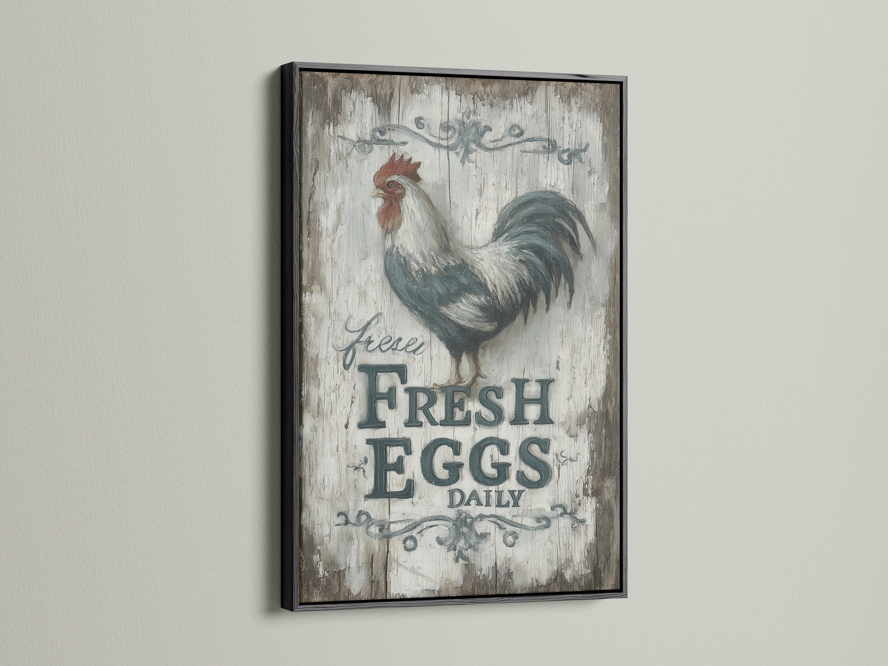 A rooster canvas print in a black frame. This vintage farmhouse kitchen art is perfect for country home decor. The Fresh Eggs Daily sign adds a touch of rustic charm. The black frame enhances the artwork's appeal. Ideal for any kitchen.