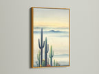 Landscape Print in a Gold Frame. This cactus artwork offers a touch of Southwestern elegance. The gold frame adds a luxurious feel. Ideal for lobbies waiting rooms or as a focal point. The earth tone art complements any space.