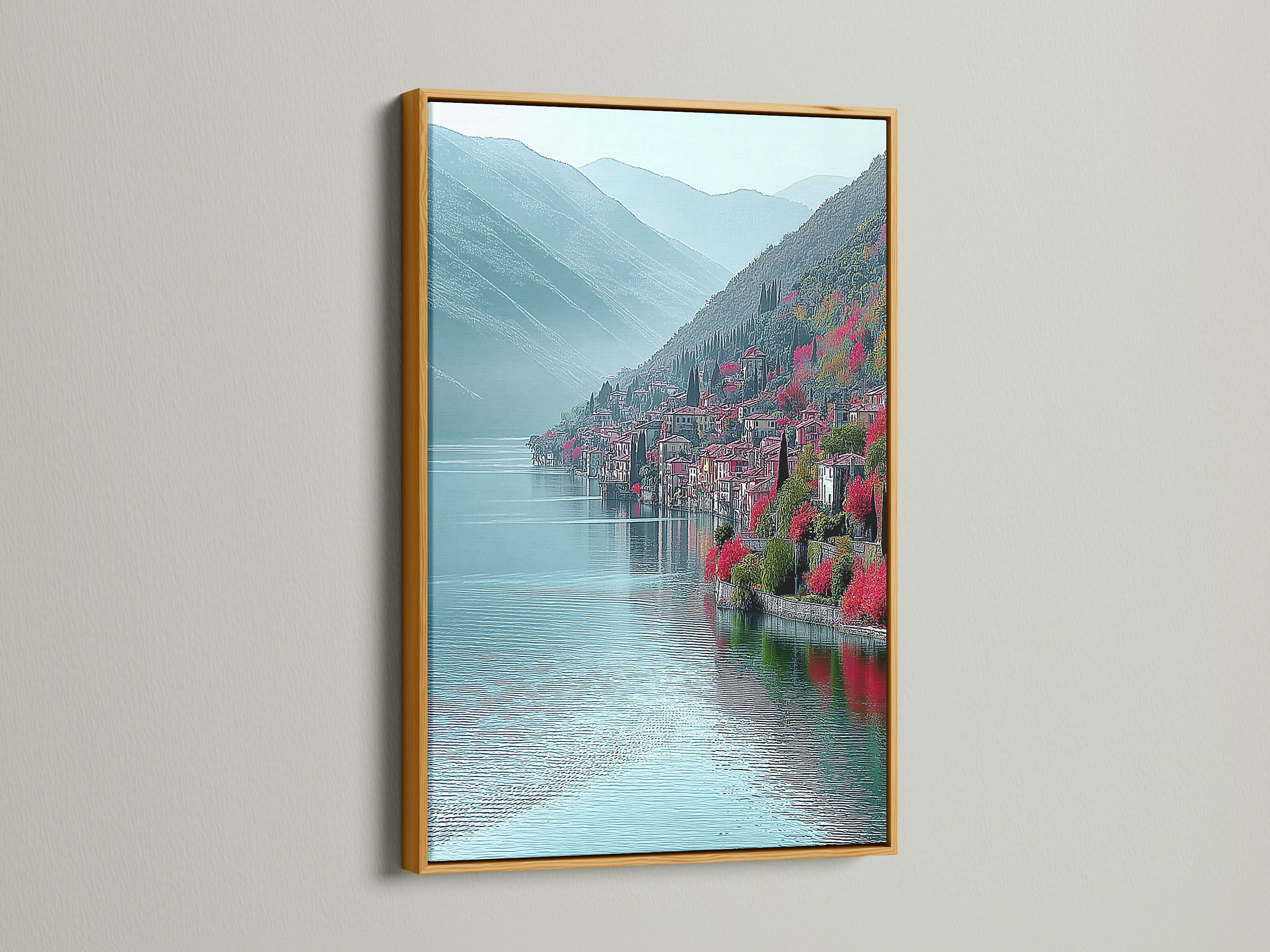Lake Como Italy canvas artwork with gold frame. The gold frame adds a touch of elegance to this Italian decor. The teal mountain landscape shines. Coastal wall art that brings the beauty of Lake Como to your home. Perfect as a travel art print. The turquoise wall art enhances any space.