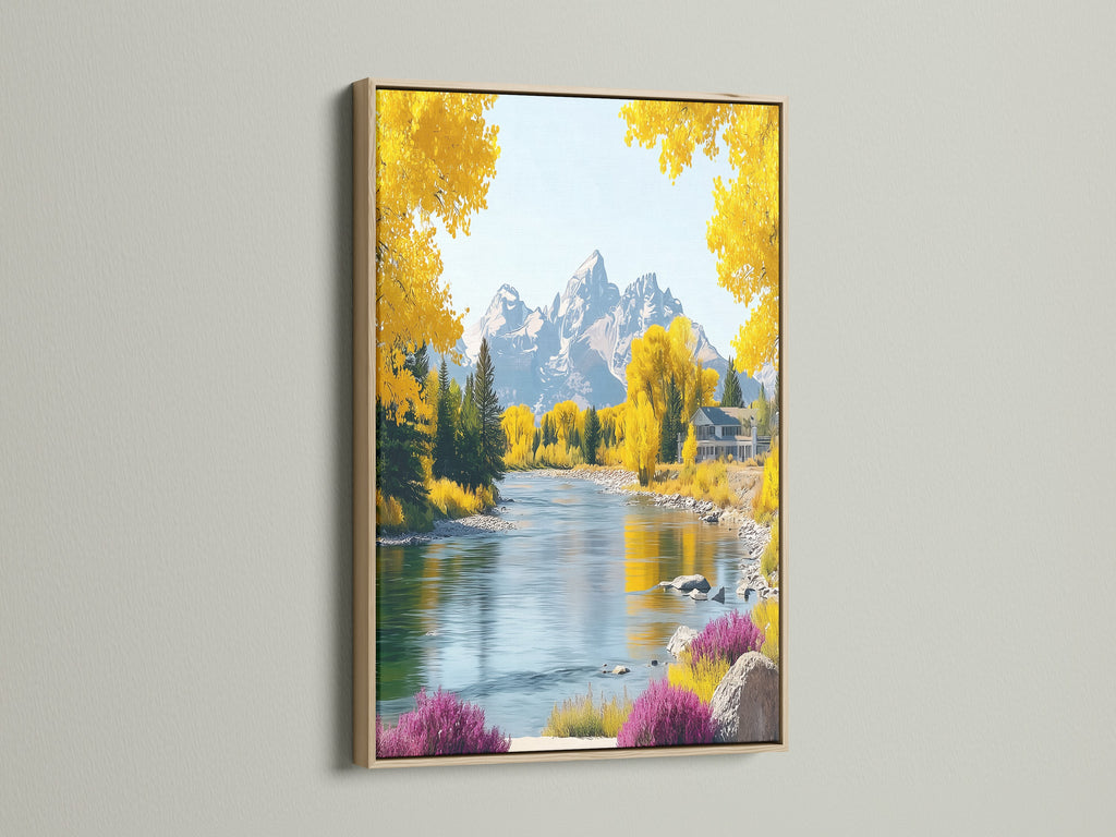 This is a river canvas featuring an autumn landscape. The artwork is framed in oak. The print showcases yellow trees and a mountain scene. Perfect wall art for adding a rustic touch to any room.