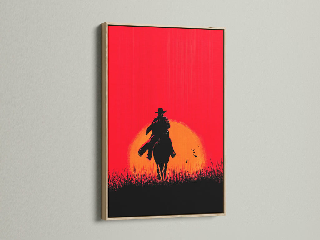 Cowboy Sunset Canvas Print with oak frame. This western wall art showcases a red orange silhouette of a cowboy on horseback. Ideal rustic artwork for living rooms bedrooms or man caves. A great addition to your western home decor.