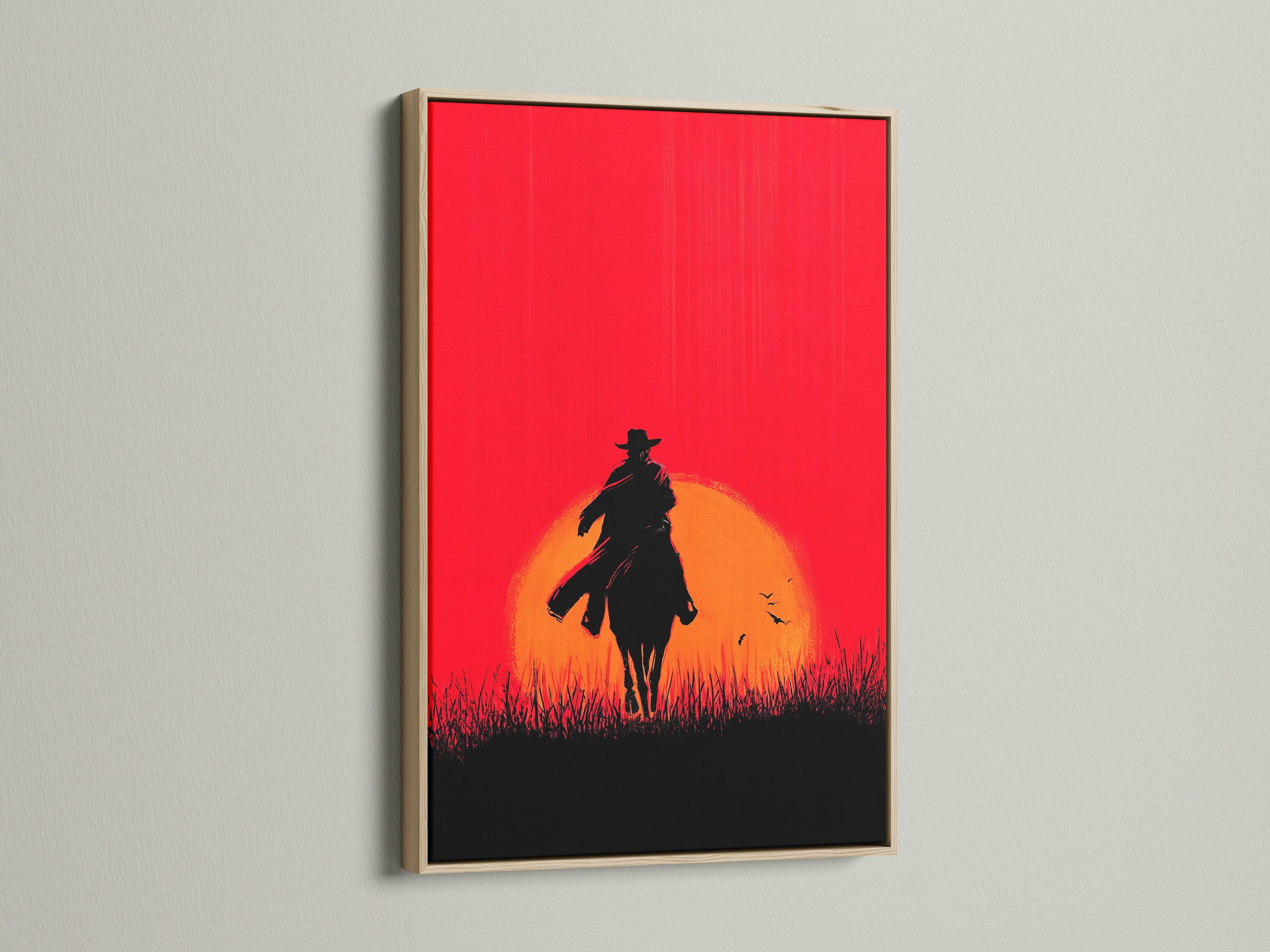 Cowboy Sunset Canvas Print with oak frame. This western wall art showcases a red orange silhouette of a cowboy on horseback. Ideal rustic artwork for living rooms bedrooms or man caves. A great addition to your western home decor.