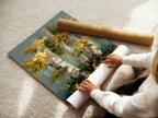 A woman rolls a fine art poster paper. The artwork is the birch tree canvas print. It is available as a fine art poster. Ideal for homeowners and renters seeking nature wall art.