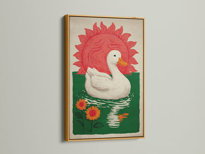 Bohemian Style Wall Art in a gold frame. The art features a white duck floating on green water with orange sunflowers. A red sun is in the background. This whimsical decor would be great for a dining area. Consider this colorful art for farmhouse rustic or eclectic styles.