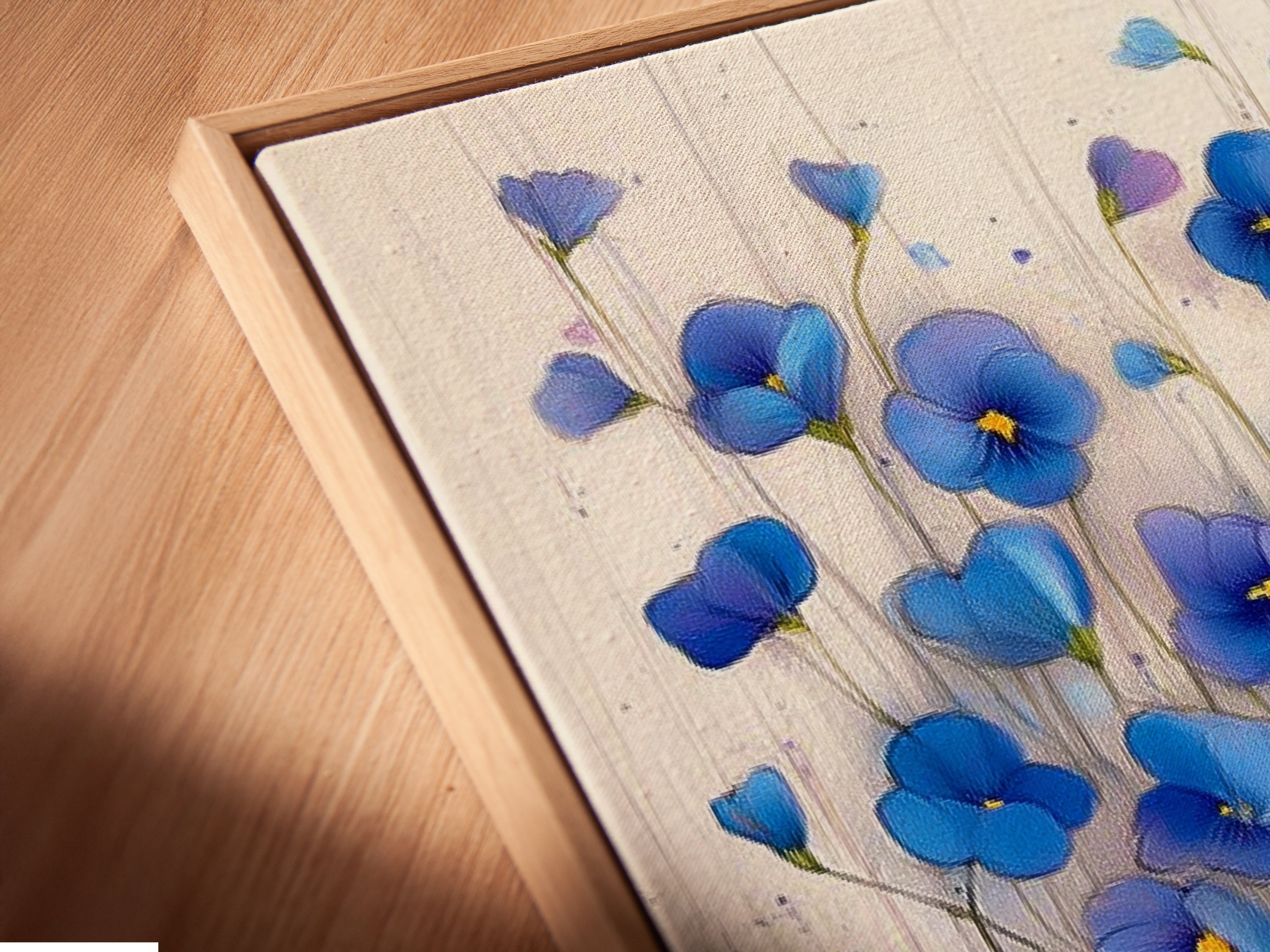 A close-up of canvas print in floating frame. The blue floral artwork stands out with its modern flower artwork. This botanical art adds a touch of elegance to your bedroom. Find your perfect teal wall decor today.