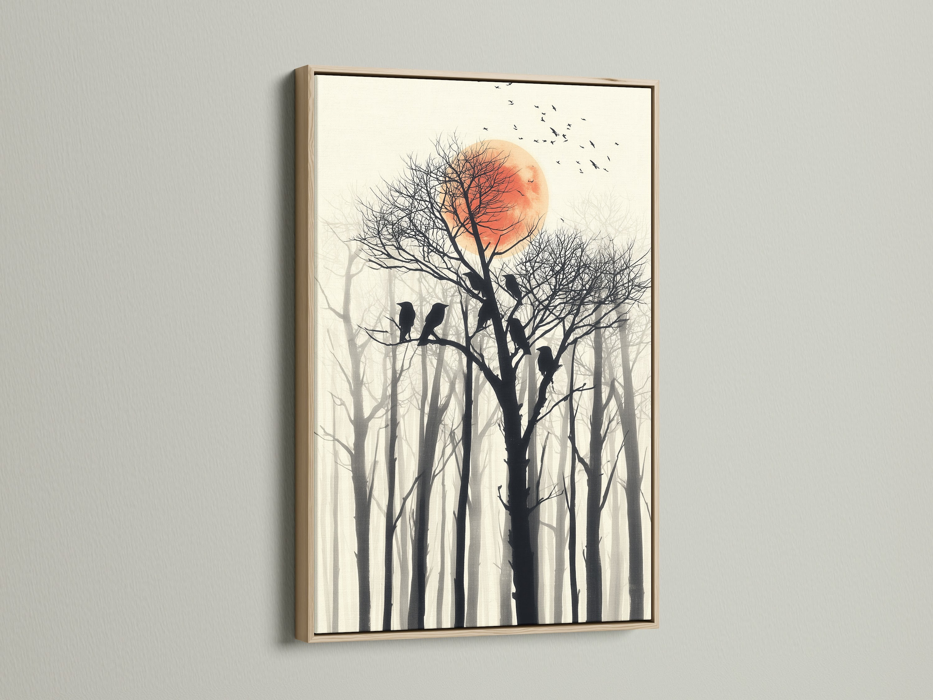 Birds on tree canvas print. This artwork features a red sun and a forest silhouette. The artwork is framed in an oak frame. It is ideal for homeowners and interior stylists seeking minimalist art.