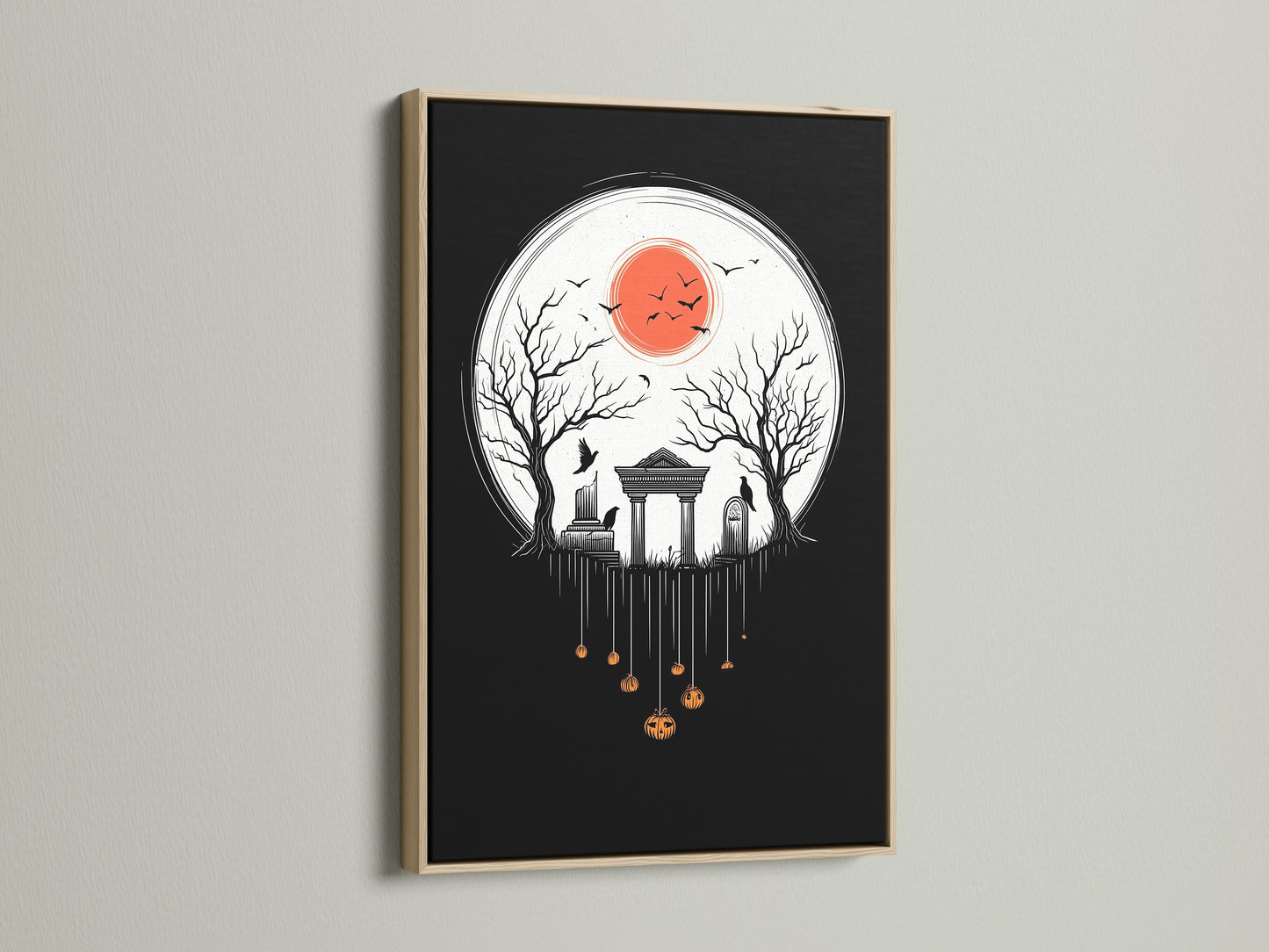 A close-up shot features the Halloween Night canvas print in an oak frame. The artwork shows a spooky cemetery scene. Consider this gothic wall art for your home this fall season. It makes a unique Halloween gift.