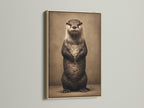 Oak frame displaying an otter art print. This animal art print brings wildlife indoors. The cute otter artwork is ideal for nursery wall decor. It is also great for bathroom wall art. This wildlife canvas is a wonderful gift for animal lovers. It enhances home decor with its unique charm