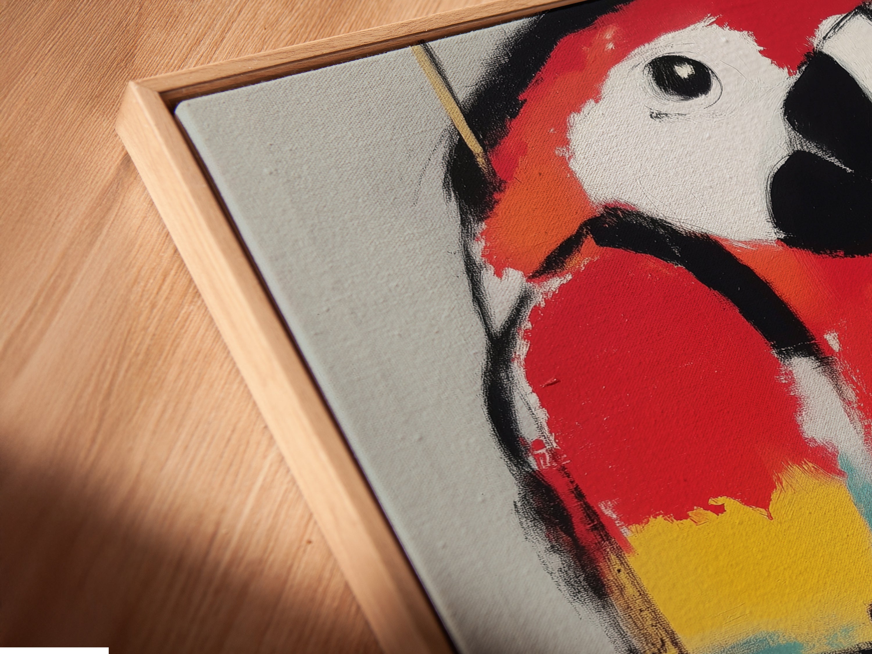 This is a close-up of a canvas print in a floating frame. The modern parrot artwork is vibrant and colorful. The abstract animal artwork enhances the contemporary style. Perfect for adding a touch of elegance to your space. This bird canvas print is great for any room decor.