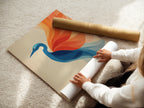 A woman is carefully rolling a fine art poster paper. Preparing a crane artwork print for display or shipping. This demonstrates the care and attention to detail. Our fine art poster paper ensures high-quality prints.