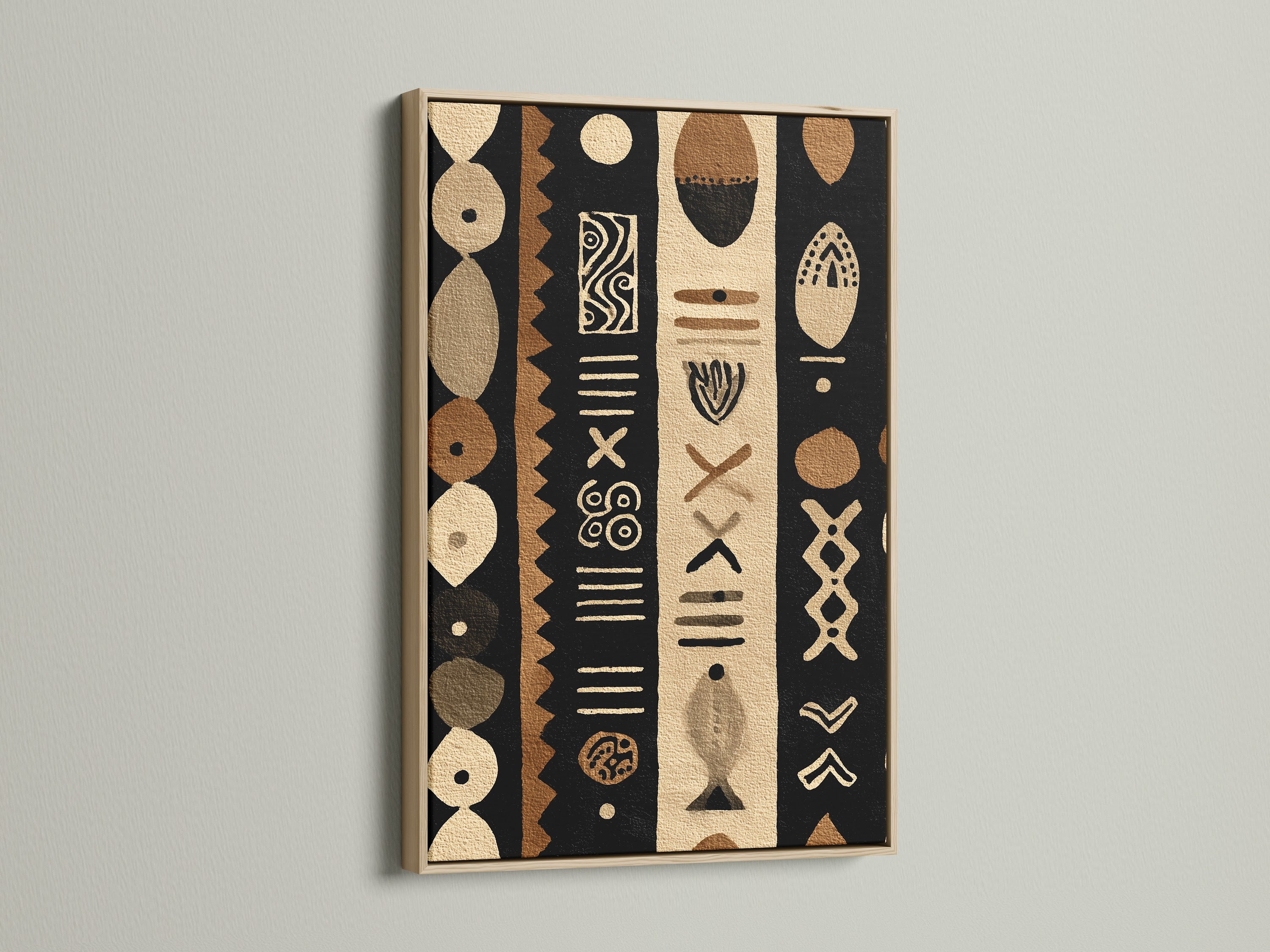 A captivating oak frame showcases a tribal artwork. The art features black brown and beige colors. The artwork is displayed against a white wall. The natural wood grain of the oak frame enhances the room's warmth.