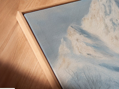 Angled close-up reveals the textured beauty of a canvas print in a floating frame. The snowy landscape wall art brings rustic artwork to life. Perfect farmhouse decor for a cabin. Experience the depth and detail of fine art.