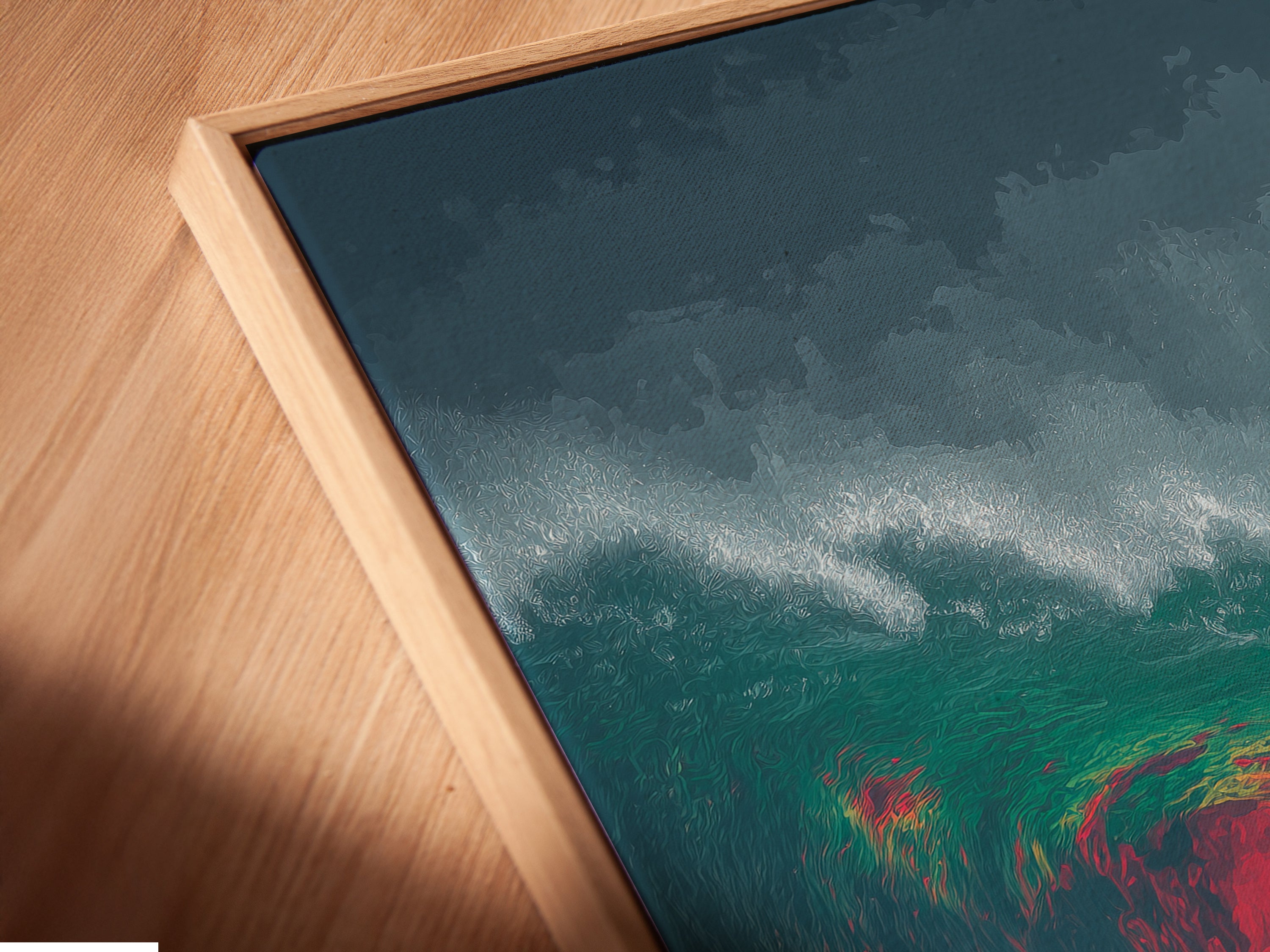 Close-up of a Dolphin Wave canvas print in a floating frame. The angle highlights the texture and colors. This marine artwork is ready to hang. It's a perfect addition to your coastal themed room.
