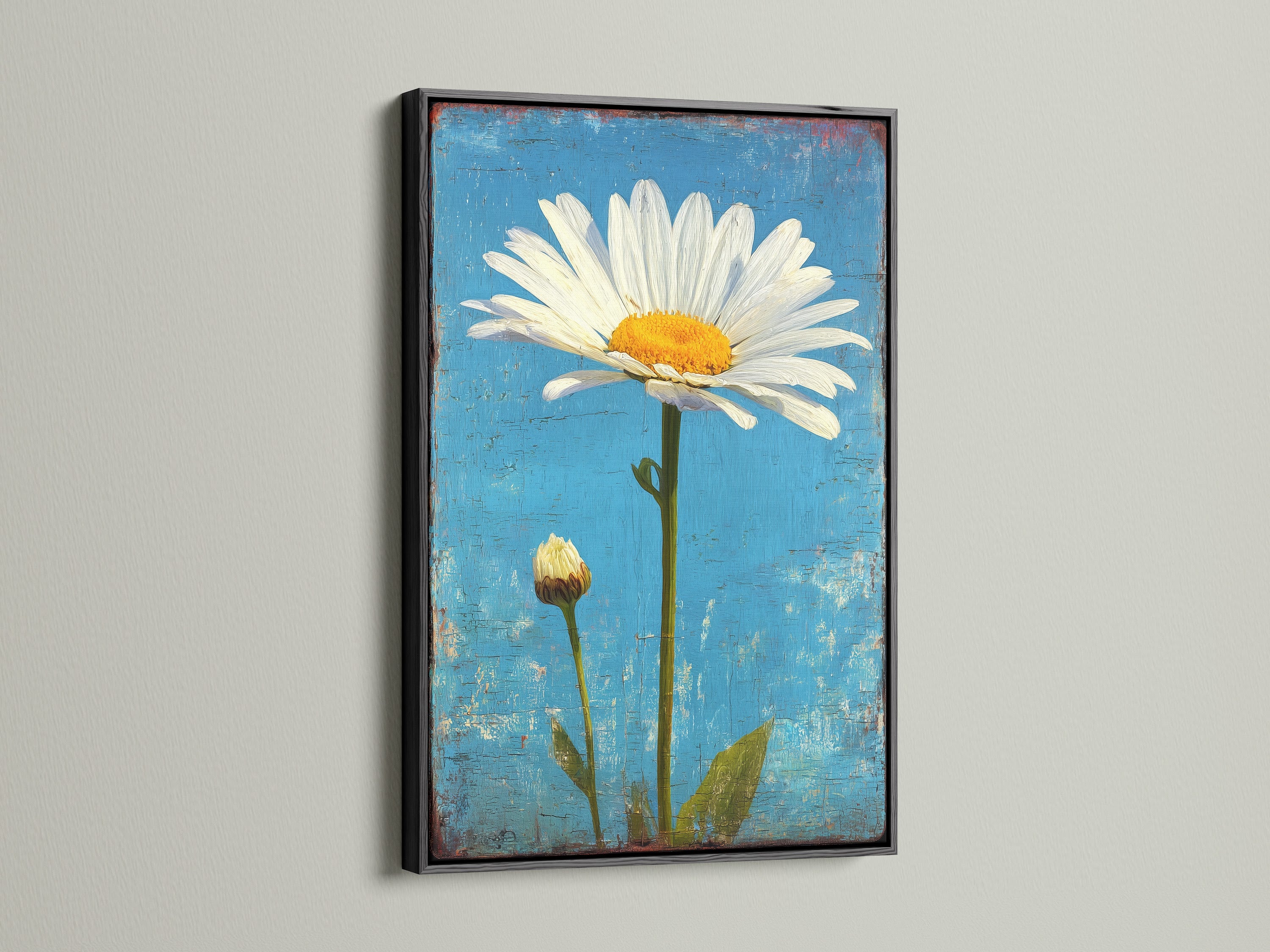 Artwork featuring a daisy against a blue textured background. It is presented in a sleek black frame. This framed art adds a modern touch to any wall. The contrast of the black frame makes the colors pop.