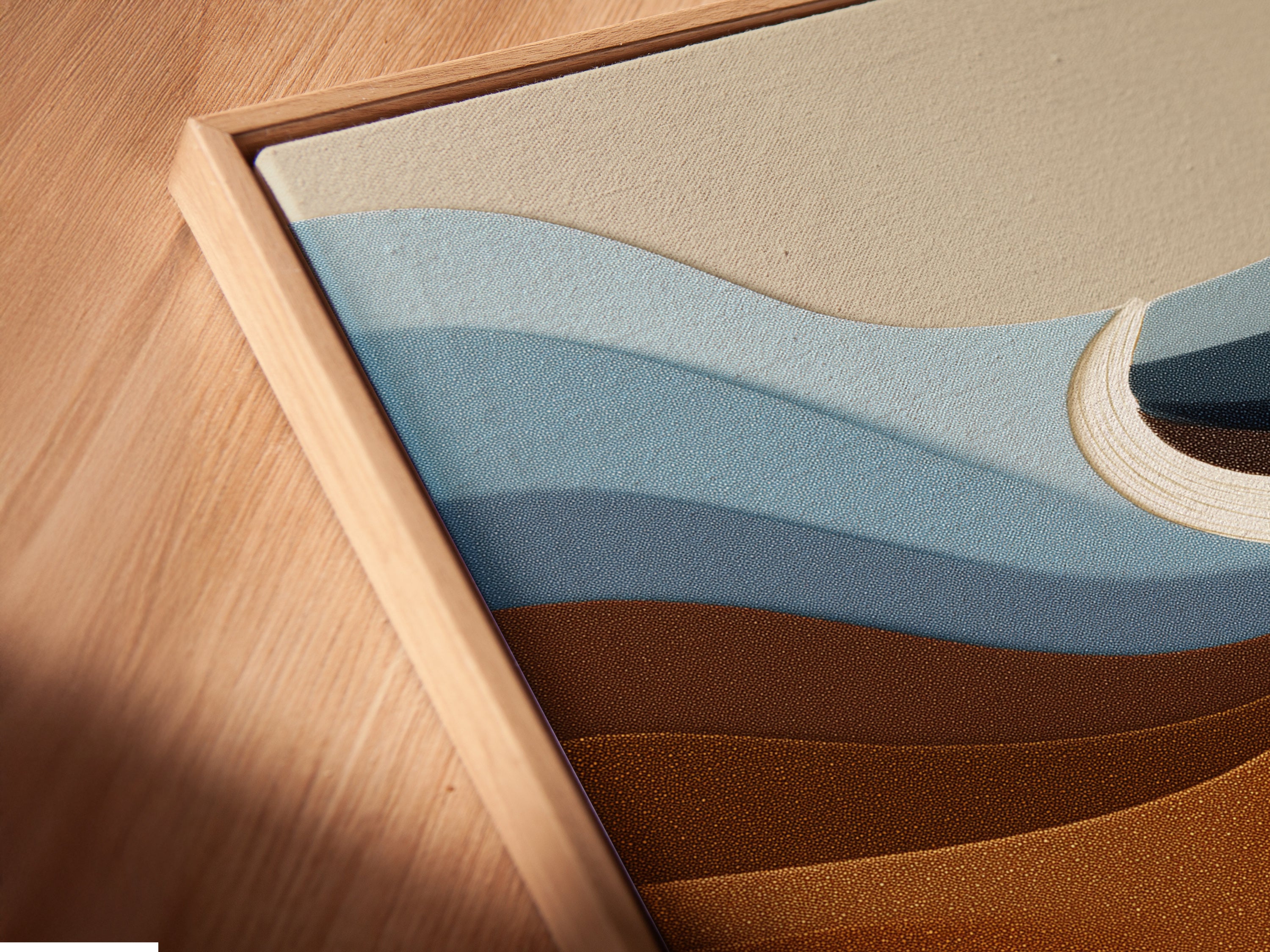 A close up angled view reveals the canvas print in a floating frame. This modern artwork gives a contemporary feel. The earthy tones provide a soothing aesthetic. The floating frame enhances the art's visual appeal. Perfect for adding sophistication to your living space. This piece is ready to hang and enjoy.