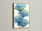 A stunning blue floral canvas print in a gold frame. The gold frame adds a touch of luxury to this botanical wall art. Elevate your bedroom decor with this elegant flower artwork. Gold frames enhance modern artwork.
