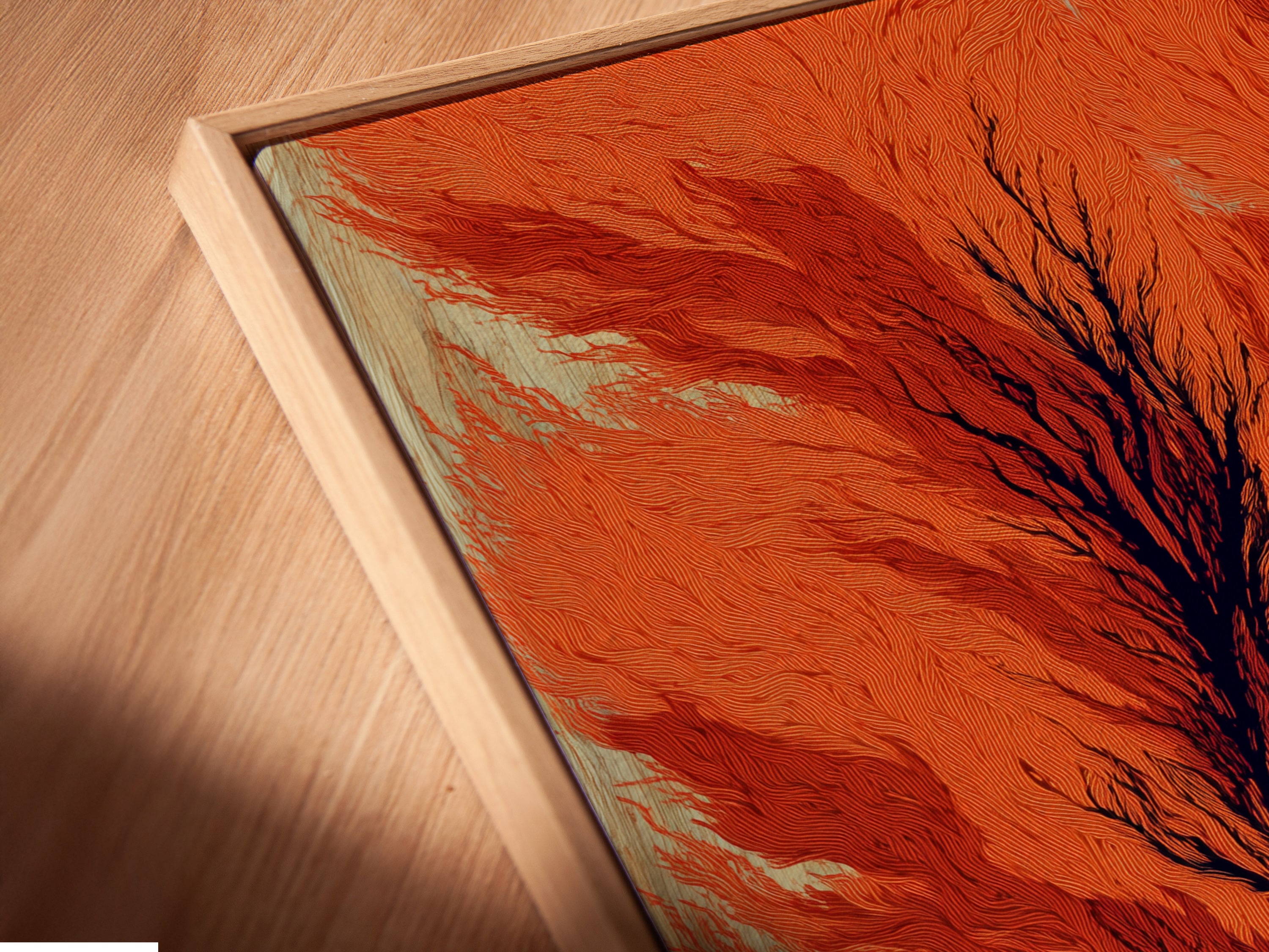 A close-up shows a canvas print in a floating frame. The abstract tree artwork features burnt orange tones. Perfect for modern botanical decor in a study. The floating frame adds a contemporary touch to this unique artwork.