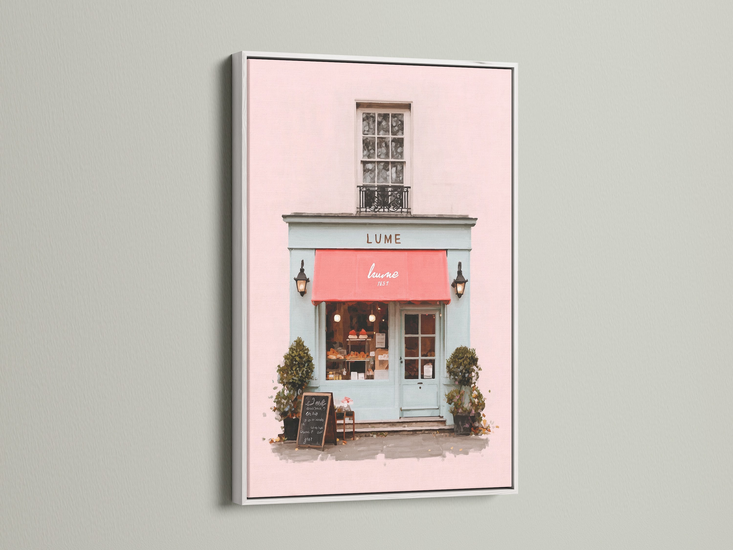 This art print is elegantly presented in a white frame. The artwork depicts a lovely building with a pink front and a striking red awning. The white frame offers a clean modern look. It allows the artwork’s colors to truly stand out. This piece is a chic addition to any space.