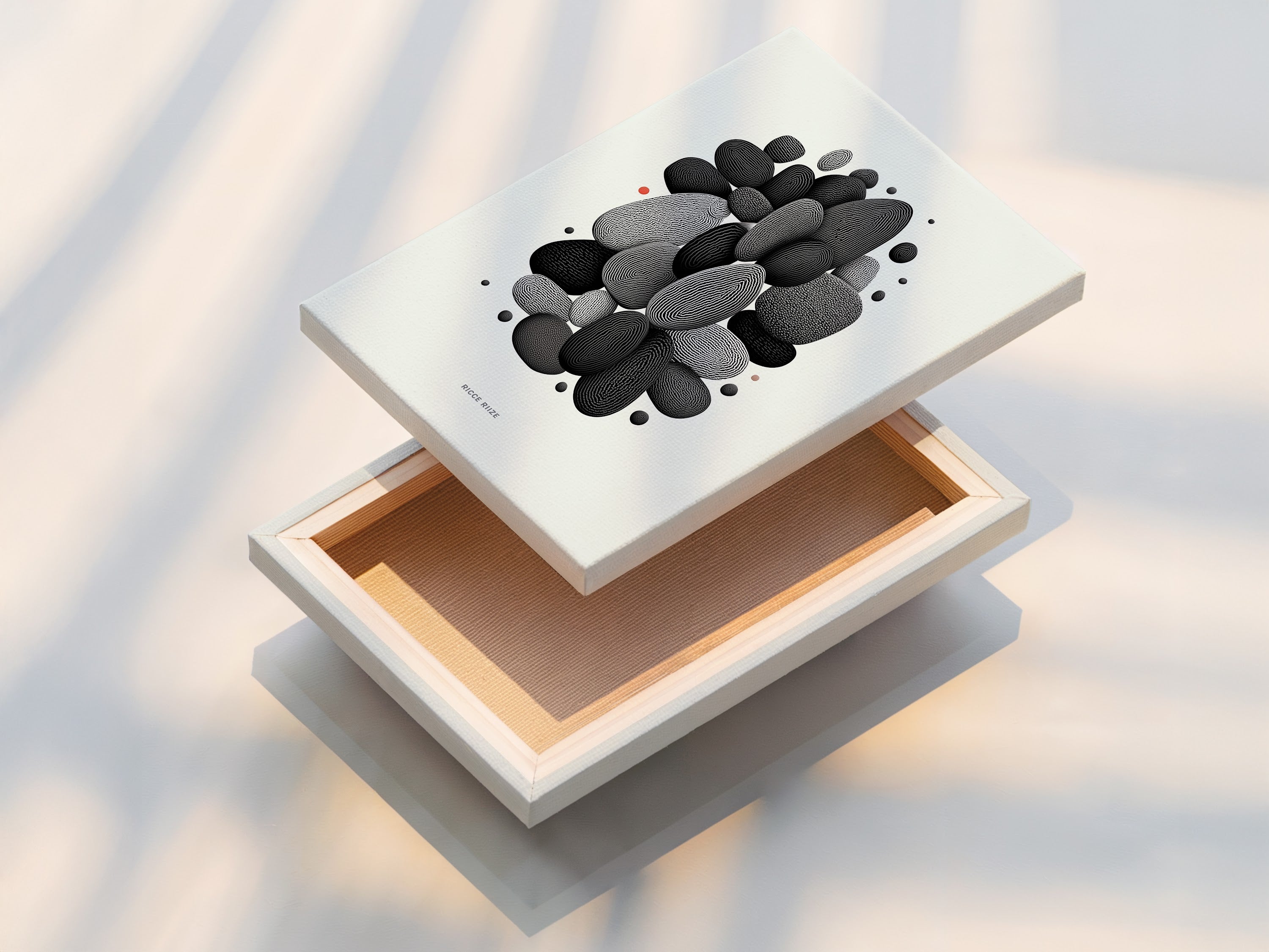 A stretched canvas print of the Abstract Pebble artwork. This minimalist black and white wall art is ready to hang. The modern stone artwork adds a contemporary touch to any space. Ideal for scandi style and minimalist interiors.