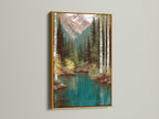 Mountain Lake artwork with a gold frame. The artwork showcases a serene teal lake with birch trees and mountains. The gold frame adds a touch of luxury and sophistication to the nature-inspired art. Ideal for homeowners and cabin owners. Elevate your decor with this exquisite landscape print.