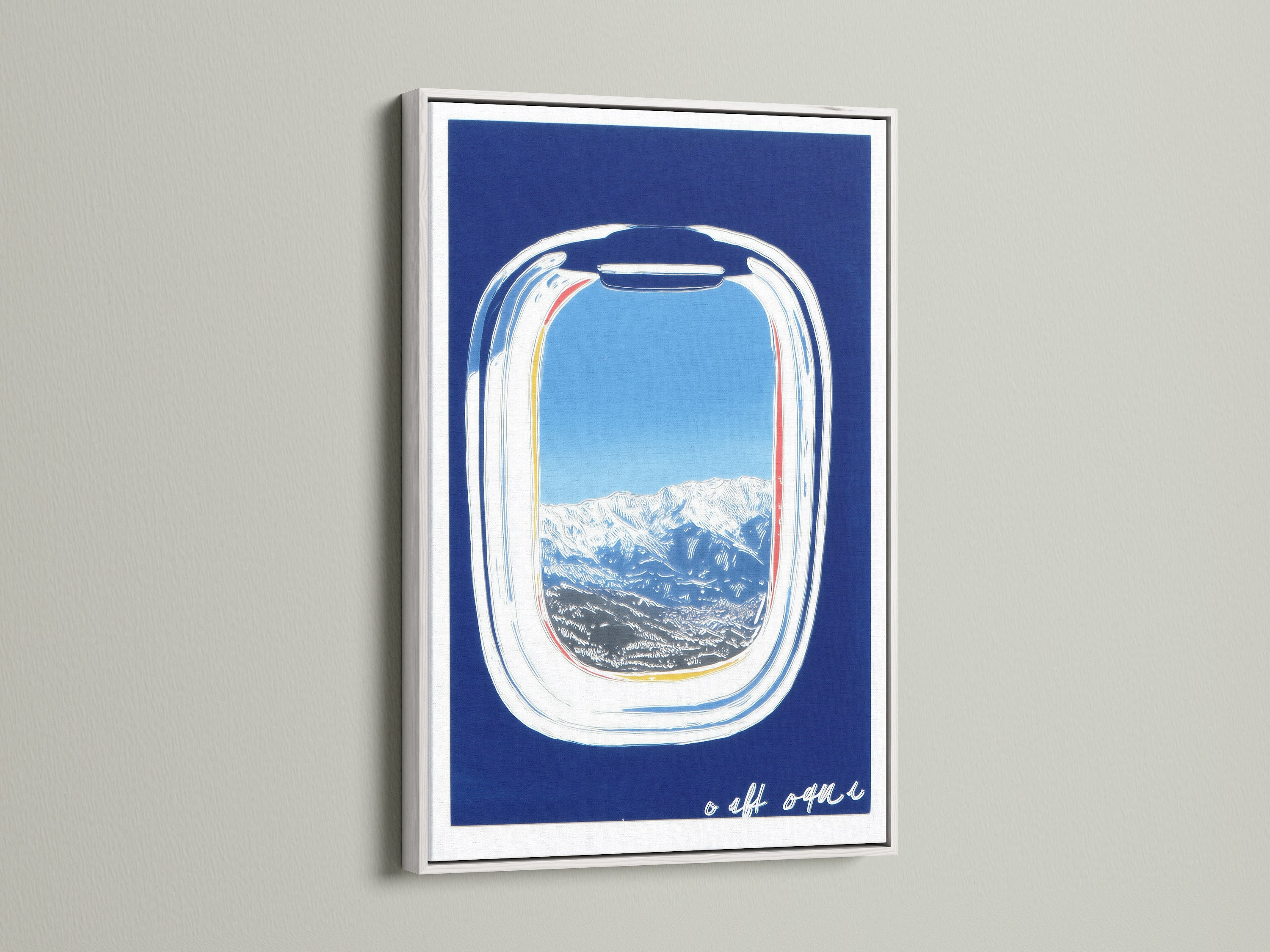 Artwork featuring an airplane window view in a white frame. The art displays a beautiful mountain landscape with a clear blue sky. A modern print perfect for adding vacation vibes to any room. A great travel gift idea.