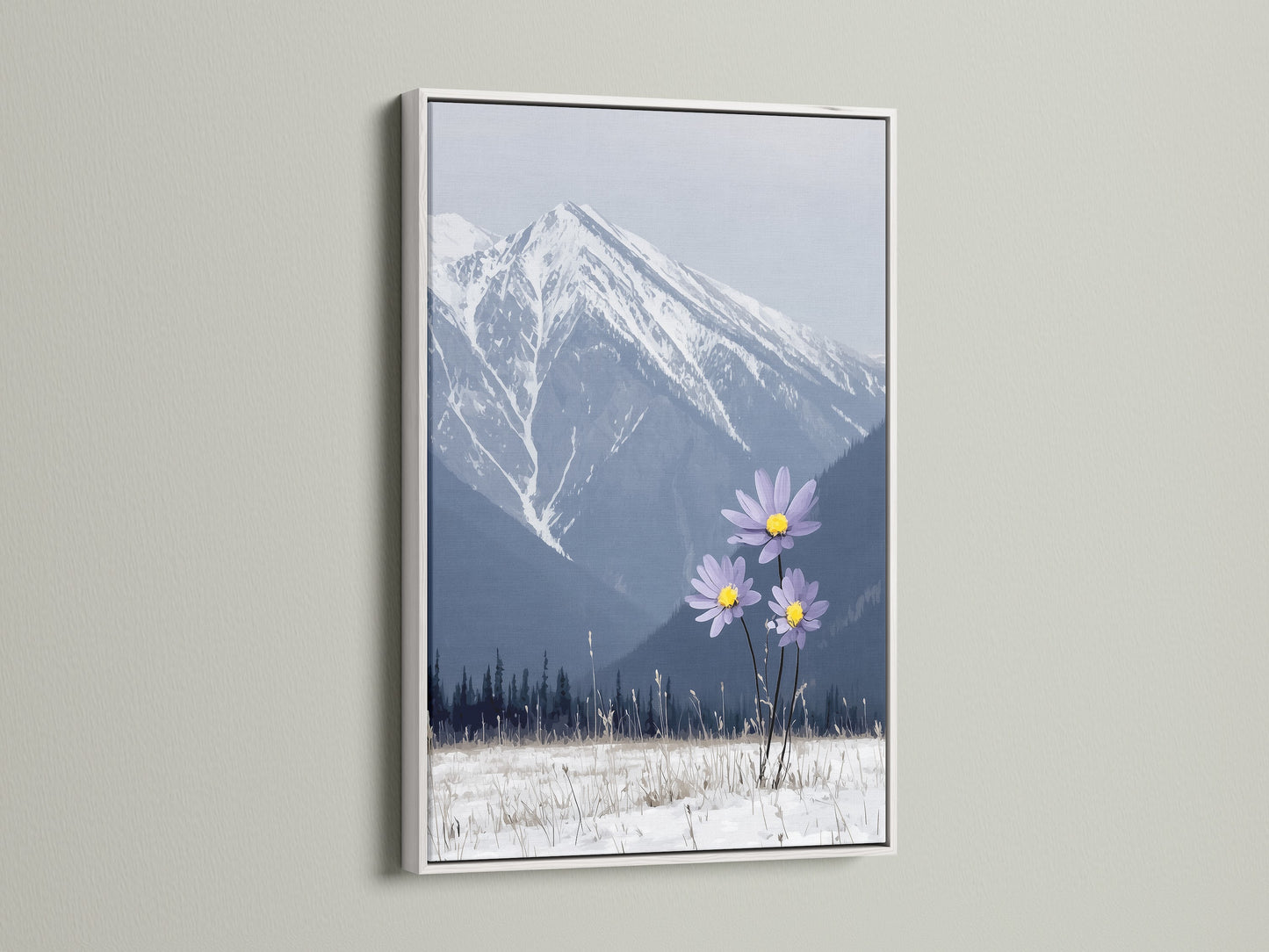 A mountain flower canvas print is elegantly displayed in a white frame. This winter print captures a stunning landscape. Snowy mountains and lilac flowers create a serene bedroom art piece. The modern decor adds a fresh touch to your space.