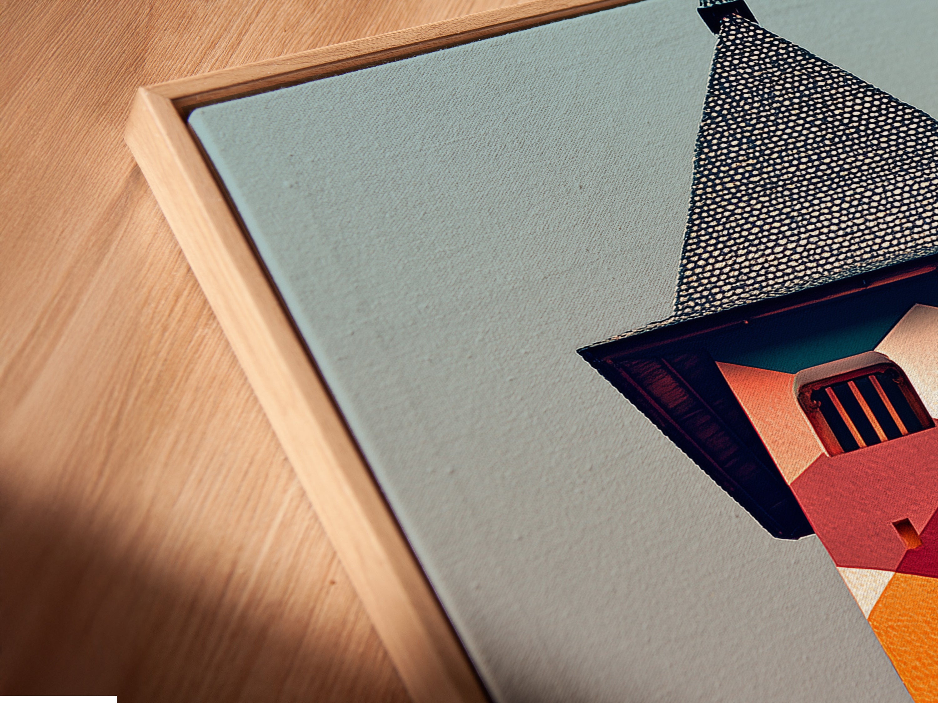 An angled close-up shows a canvas print in a floating frame. The geometric building wall art features a colorful clock tower. This modern piece enhances any space. The floating frame adds a touch of sophistication to this architecture artwork.