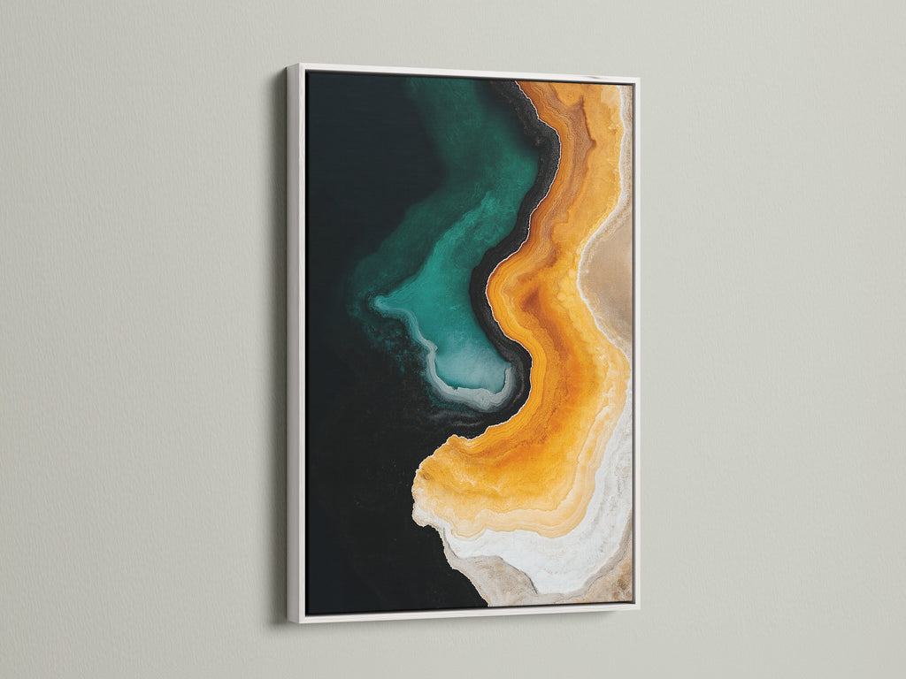 Abstract Resin Art Painting in a white frame. The artwork showcases emerald green and orange geode patterns. This modern canvas print adds a contemporary touch to any room. The white frame complements the art beautifully.
